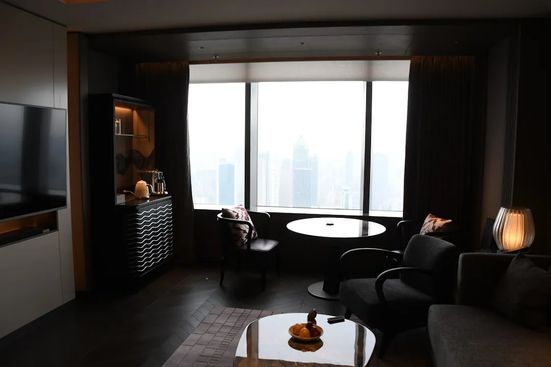 Modern living room with city view through window