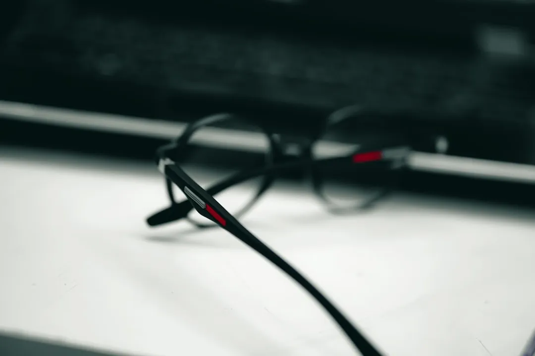 a pair of glasses sitting on top of a table